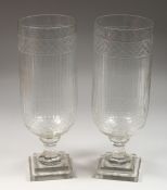 A PAIR OF CUT GLASS STORM LANTERNS. 17ins high.