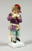 A SMALL BERLIN PORCELAIN FIGURE OF A BOY 3.5ins high.