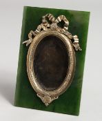 A GOOD RUSSIAN AGATE AND SILVER PHOTOGRAPH FRAME, oval with ribbon motif. 5.75ins x 3.75ins. Mark