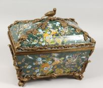 A GOOD PORCELAIN CASKET with ormolu mounts, decorated with birds and flowers. 14ins long.