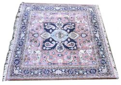 A PERSIAN CARPET, orange ground, decorated in pale and dark blue, with stylised birds. 6ft 7ins x