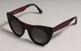 NEARLY NEW CARRERA SUNGLASSES in a pouch.