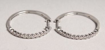 A PAIR OF 18CT WHITE GOLD DIAMOND HOOP EARRINGS.