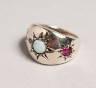 A SILVER, RUBY AND OPAL RING.