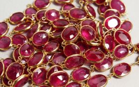 A VERY GOOD GOLD, RUBY SET LONG CHAIN.