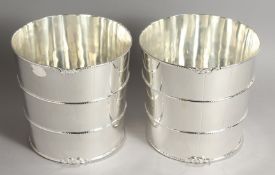 A PAIR OF PLATE BARREL SHAPED WINE COOLERS.