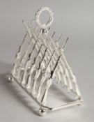 A PLATE NOVELTY CROSS GUNS TOAST RACK.