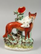 A STAFFORDSHIRE SPILL VASE with a figure of a fox with a bird in it's mouth. 9ins Illustrated page