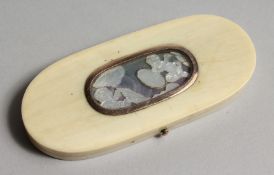 A GEORGIAN IVORY LONG PIN BOX, the top with two cupids. 3.75ins x 1.5ins.