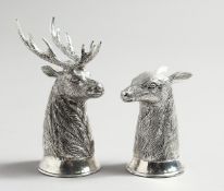 A PAIR OF .800 DEERS’ HEAD SALT AND PEPPERS, stag and doe.