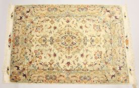 A FINE PERSIAN PART SILK TABRIZ RUG, cream ground with floral decoration. 7ft 2ins x 4ft 11ins.