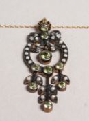 A 9CT GOLD AND SILVER SET PERIDOT AND PEARL PENDANT on chain.