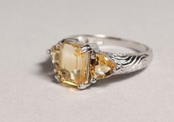 A SILVER CITRINE RING.