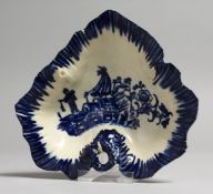 AN 18TH CENTURY LIVERPOOL LEAF DISH, printed with the Fisherman pattern under a blue painted