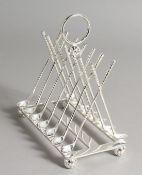 A PLATE NOVELTY GOLFING TOAST RACK.