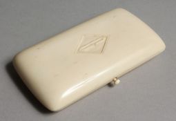 AN IVORY NECESSAIRE with gilt fittings, scissors, thimble etc. 4.25ins x 2.25ins.