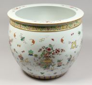 A GOOD CHINESE PORCELAIN JARDINIERE, famille rose with emblems. 15.5ins diameter.