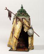 A VERY GOOD VIENNA PAINTED BRONZE TENT, a seated figure inside. 13ins high.