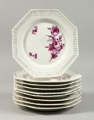 A SET OF NINE BERLIN OCTAGONAL PLATES with lattice border with flowers in puce. Septre mark, 8ins