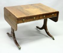 A REGENCY ROSEWOOD SOFA TABLE, of rounded rectangular form, with two frieze drawers, two drawers