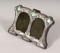 A SILVER AND ENAMEL DOUBLE PHOTOGRAPH FRAME. 3ins x 4.5ins.