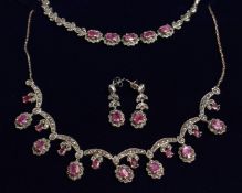 A SILVER MARCASITE RUBY SET FOUR PIECE, NECKLACE, BRACELET AND EARRINGS