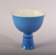 A CHINESE MING STYLE TURQUOISE DRAGON CUP - the body incised with dragons and the base with a six