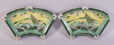 A PAIR OF CHINESE FAMILLE VERTE PORCELAIN DISHES, each painted with a carp and stylised waves,
