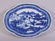 A CHINESE BLUE AND WHITE PORCELAIN DISH, the centre painted with a mountainous landscape with