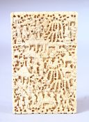 A GOOD CHINESE CANTON CARVED IVORY CARD CASE, carved with figures in a busy landscape, 10.5cm x 6.