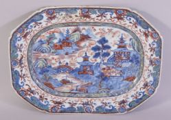 A CHINESE BLUE, RED AND WHITE / CLOBBERED RECTANGULAR PORCELAIN DISH, the centre painted with a