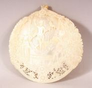 A FINE 19TH CENTURY JERUSALEM CARVED MOTHER OF PEARL SHELL, the centre carved with the figure of
