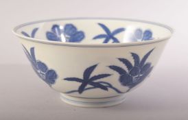 A CHINESE MING STYLE BLUE AND WHITE PORCELAIN BOWL, decorated with flowers, six character mark to