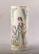 A CHINESE FAMILLE VERTE CYLINDRICAL PORCELAIN VASE, painted with two female figures and script,