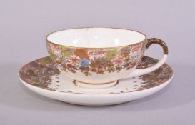 A SMALL JAPANESE KINKOZAN SATSUMA CUP AND SAUCER, finely decorated with bands of flowers, small
