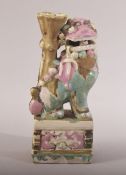A CHINESE PORCELAIN FOO DOG JOSS STICK HOLDER, 16.5cm high.
