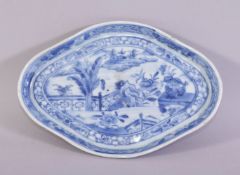 A CHINESE BLUE AND WHITE PORCELAIN DISH, the centre painted with a landscape of a lake, 19cm x