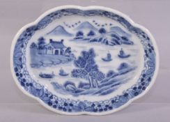 A SMALL CHINESE BLUE AND WHITE PORCELAIN TRAY, painted with a landscape including trees, figure