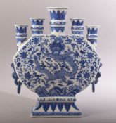 A CHINESE BLUE AND WHITE FLOWER VASE, with multi spouts / openings, the vase painted with a dragon