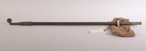 A 20TH CENTURY CHINESE SMOKING PIPE & JADE PENDANTS - the pipe with a jade ring holding a pouch with