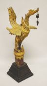 A 19TH CENTURY BUDDHIST GILT BRONZE FIGURE OF A HONGSA BIRD, inlaid with mirrored pieces, the