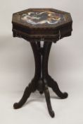 AN UNUSUAL CHINESE OCTAGONAL CARVED HARDWOOD PEDESTAL TABLE, the top inset with a cloissonne panel