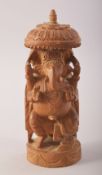 AN INDIAN CARVED SANDALWOOD FIGURE OF GANESHA, 14cm high.