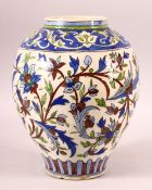 A PERSIAN QAJAR GLAZED POTTERY VASE, with stylised foliate decoration, 28.5cm high.