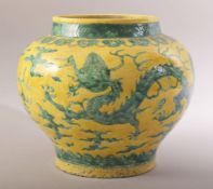 A CHINESE YELLOW GROUND PORCELAIN DRAGON JAR - with dragon's and ruyi decoration - 23cm