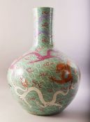 A LARGE AND IMPRESSIVE CHINESE TURQUOISE GROUND PORCELAIN VASE, decorated with multiple dragons