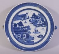 A CHINESE BLUE AND WHITE PORCELAIN WARMING DISH, painted with a landscape scene, 24.5cm.