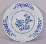A CHINESE BLUE AND WHITE PORCELAIN DISH, painted with flowers, 23cm diameter.