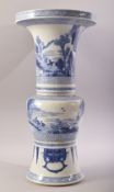 A CHINESE BLUE AND WHITE PORCELAIN GU SHAPE VASE, with panels of figures in various pursuits