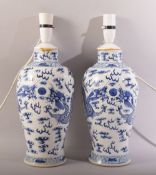 A GOOD PAIR OF CHINESE BLUE AND WHITE PORCELAIN VASES, converted to lamps (not drilled), the body of